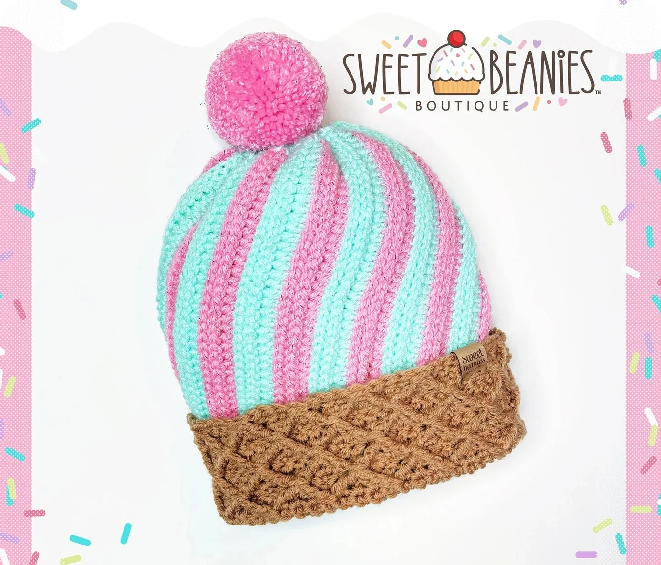 Colorful striped beanie with pom-pom on a white background, branded 'Sweet Beanies Boutique'.